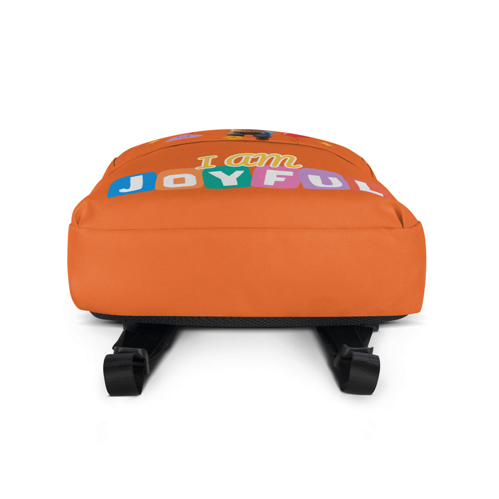 Colorful orange backpack with all-over joyful print and white bottom, designed for kids by Kingdom Kids Club.
