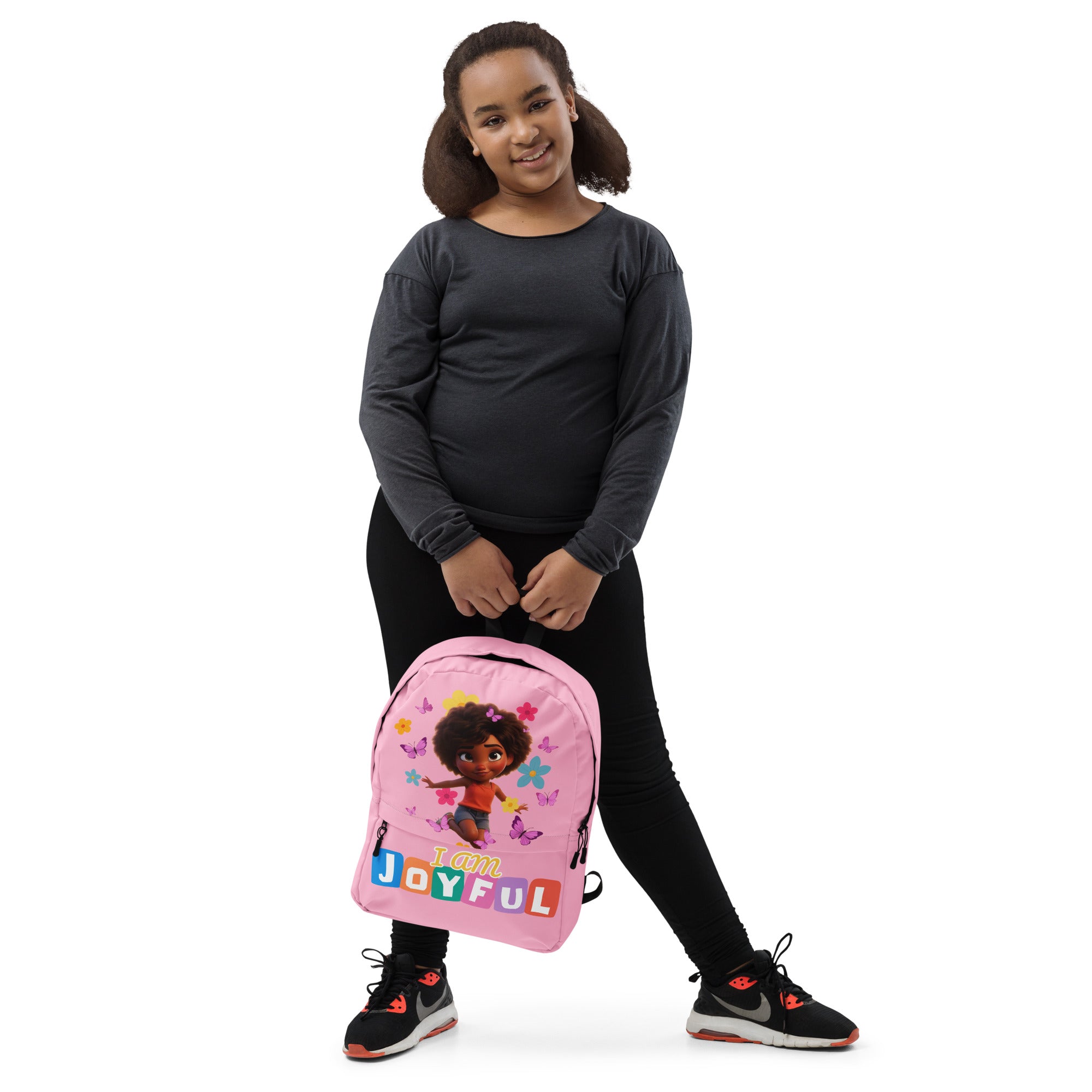 Pink Kingdom Kids Club backpack with all-over joyful pink print, front view showing adjustable straps and zip closure.