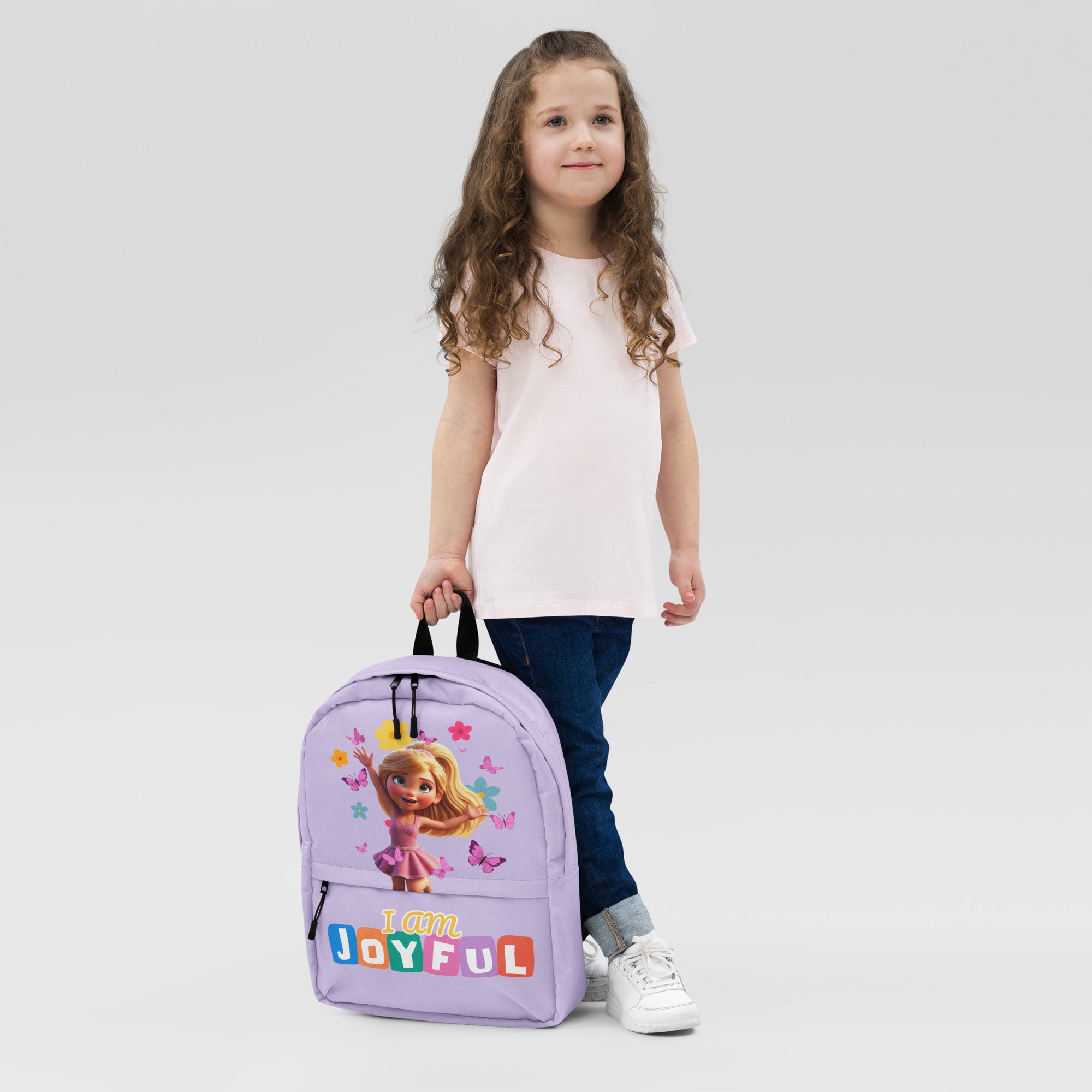 Purple backpack with all-over joyful print from Kingdom Kids Club, showing front view with adjustable straps and zip closure.