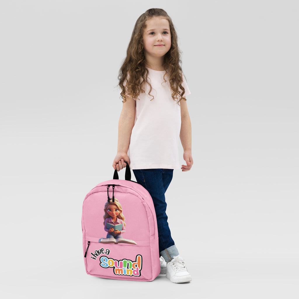Pink backpack with all-over print featuring "I Have A Sound Mind" design by Kingdom Kids Club, front view.