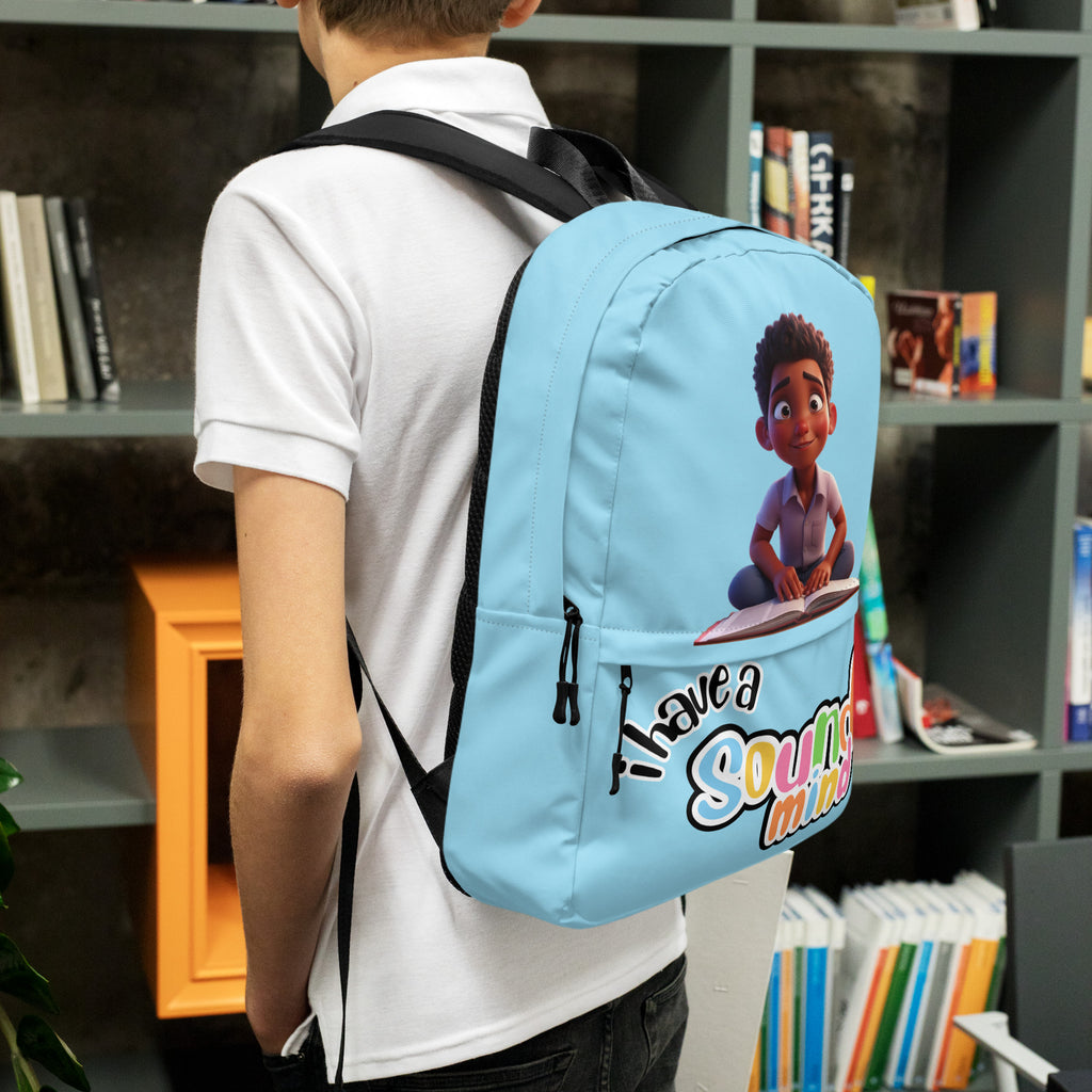 Blue backpack with all-over print featuring "I Have A Sound Mind" design by Kingdom Kids Club, shown from the left side.