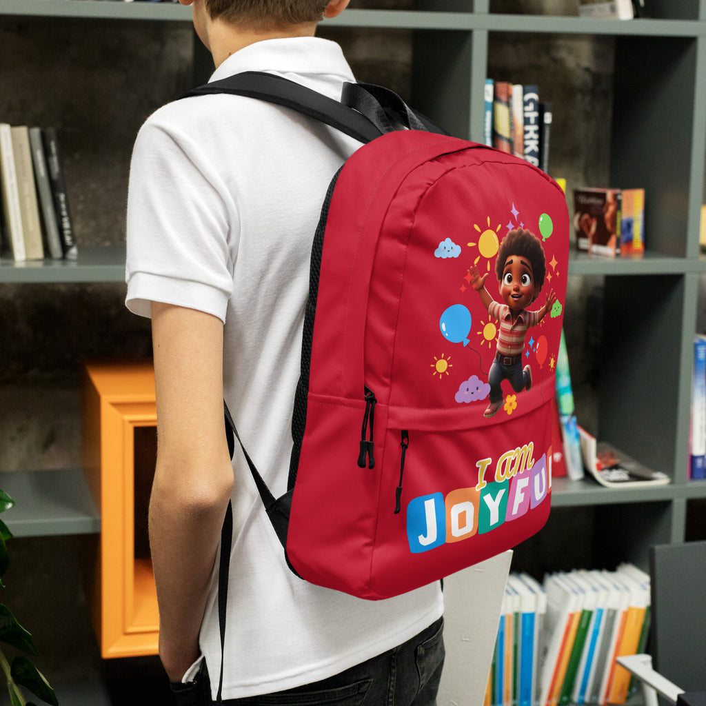 Red backpack for kids with all-over joyful print, featuring the I Am Joyful design by Kingdom Kids Club.