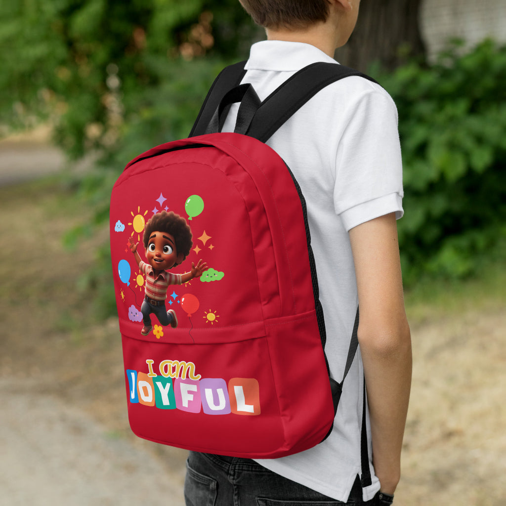Kingdom Kids Club I Am Joyful red backpack with colorful all-over print, featuring sturdy straps and multiple compartments.