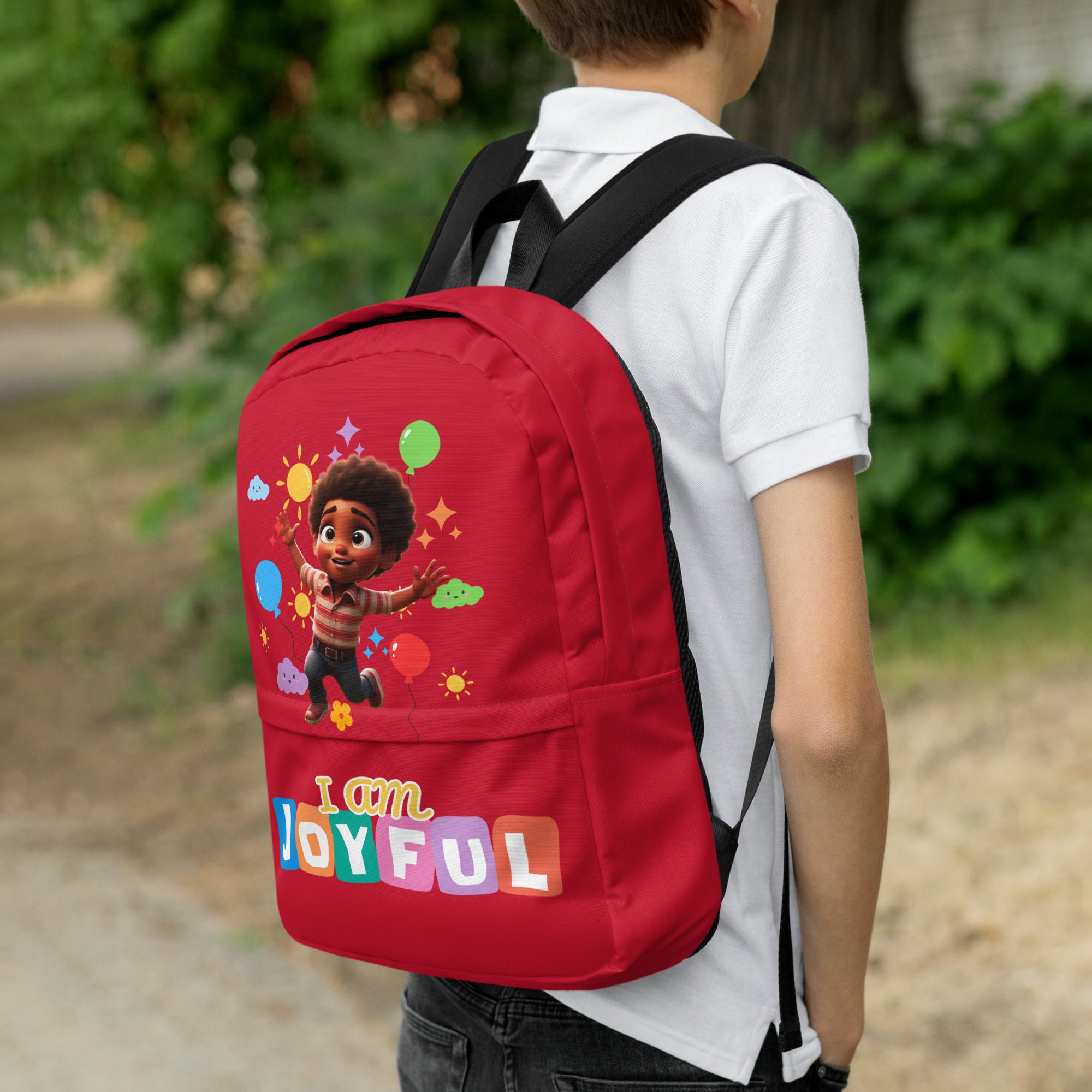 Kingdom Kids Club I Am Joyful red backpack with colorful all-over print, featuring sturdy straps and multiple compartments.