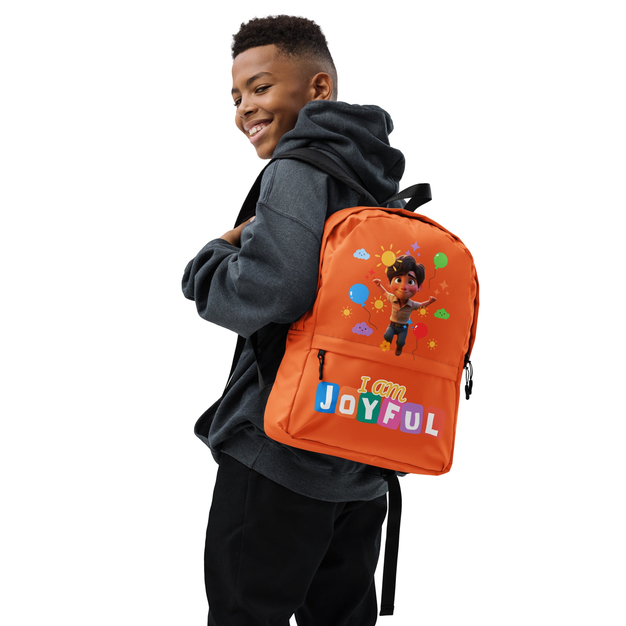 Orange backpack with all-over joyful print by Kingdom Kids Club, featuring a white background and vibrant design.